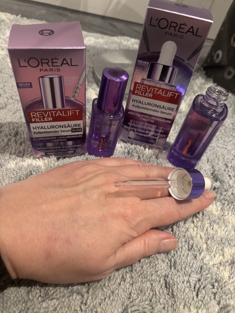 L’Oréal Revitalift Filler Serum mit Pipette auf der Haut